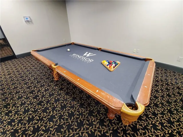 a view of swimming pool with outdoor seating