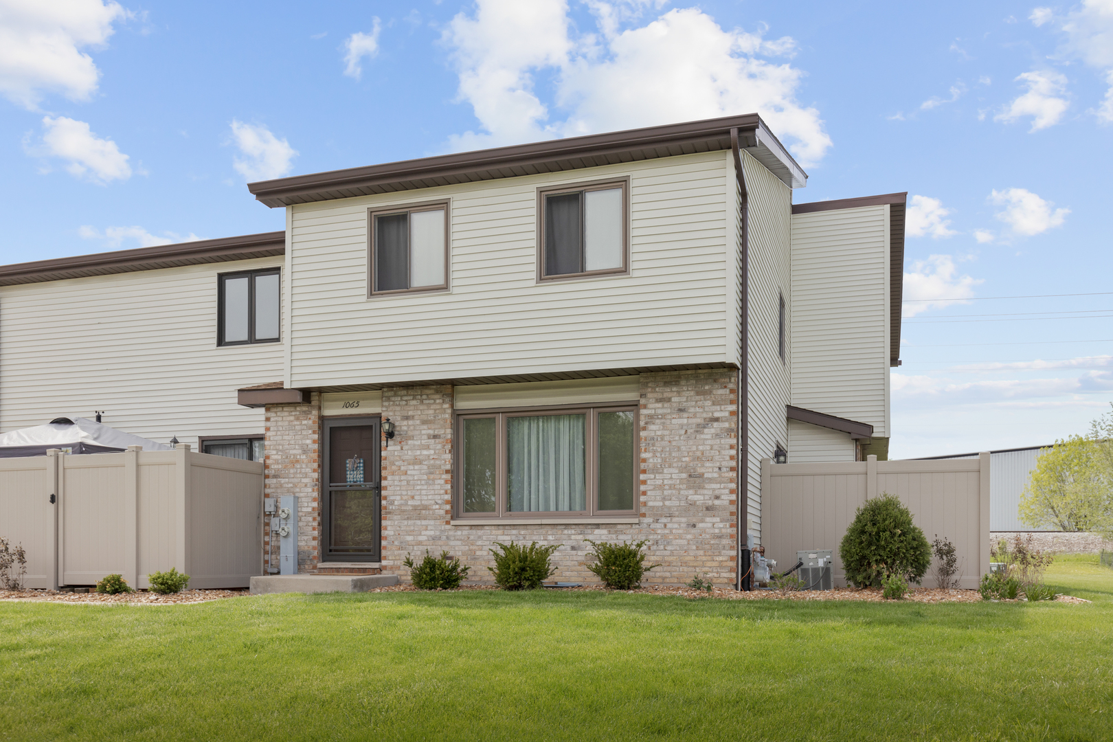 1065 Southgate Road New Lenox, IL 60451 - Photo 1 of 12 a front view of a house with a yard and tree