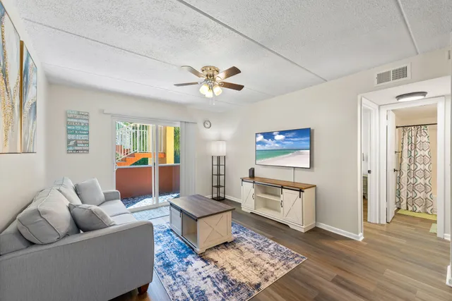 a living room with furniture and a rug