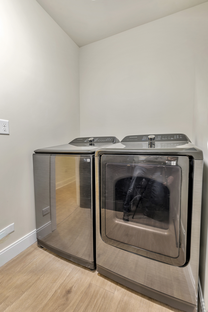 317 Canal Street, Unit B Lemont, IL 60439 - Photo 15 of 15 a utility room with wooden floor and cabinets