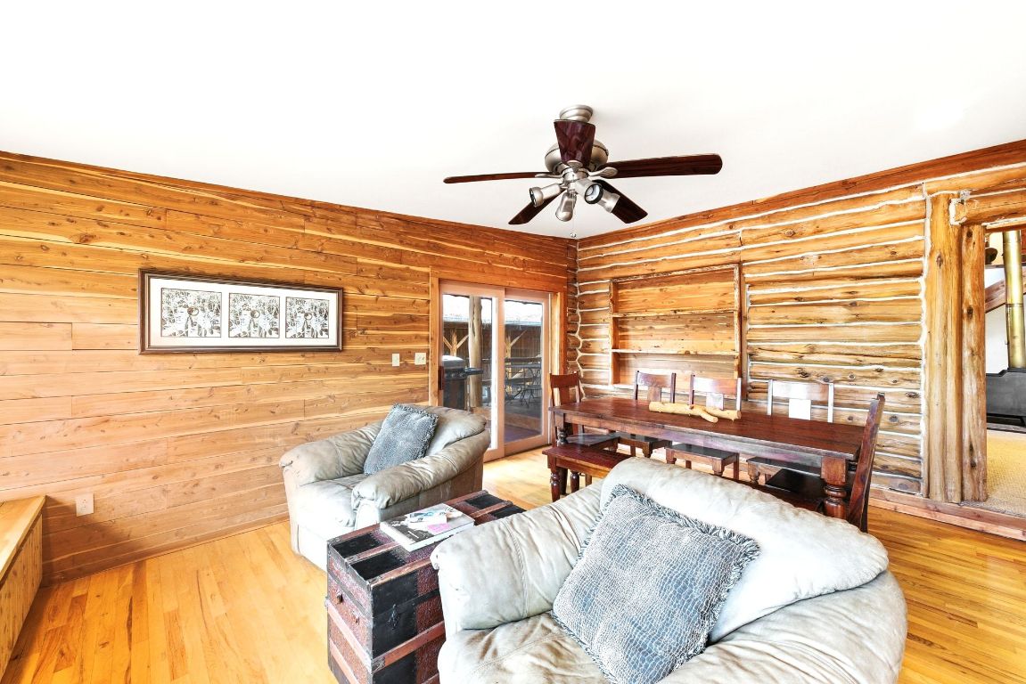 235 Antioch Road Paige, TX 78659 - Photo 13 of 40 a living room with furniture and floor to ceiling window