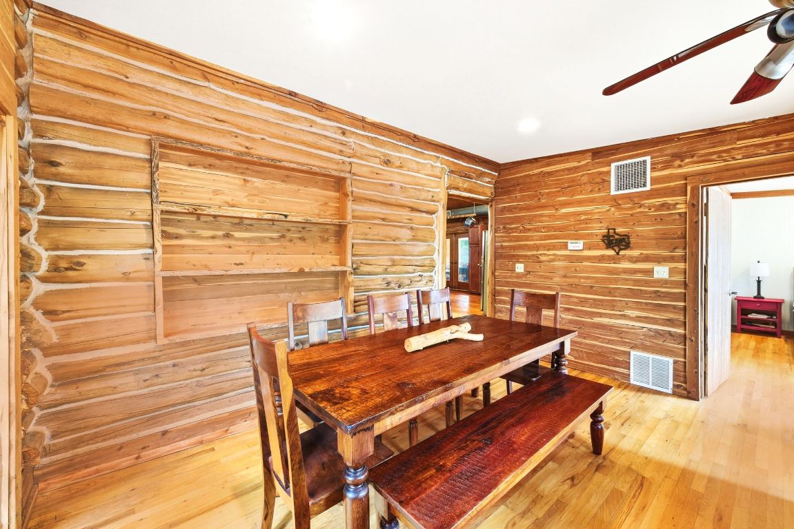 235 Antioch Road Paige, TX 78659 - Photo 14 of 40 a view of a balcony with furniture and wooden floor