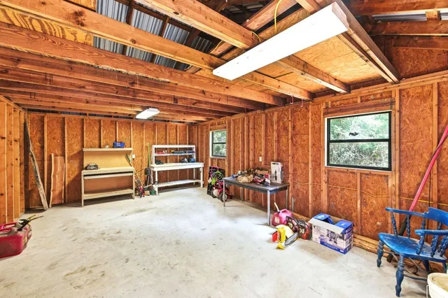 a bedroom with furniture and a bed