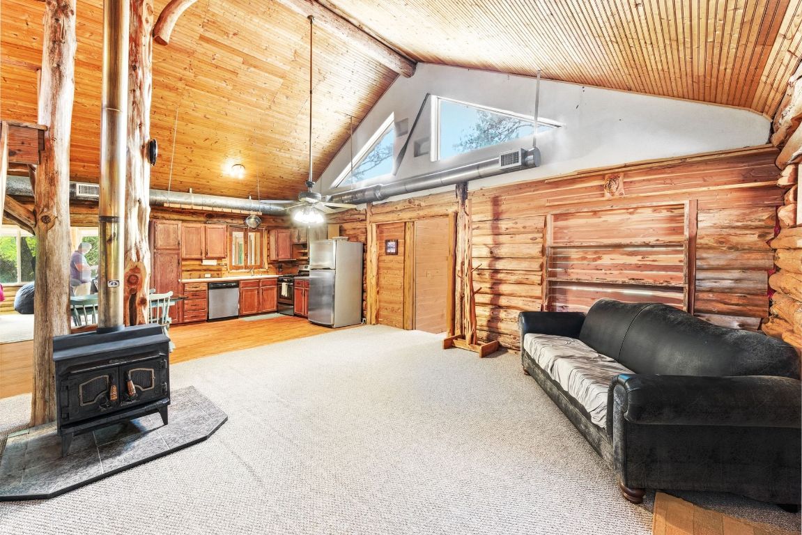 235 Antioch Road Paige, TX 78659 - Photo 4 of 40 a living room with furniture and a fireplace