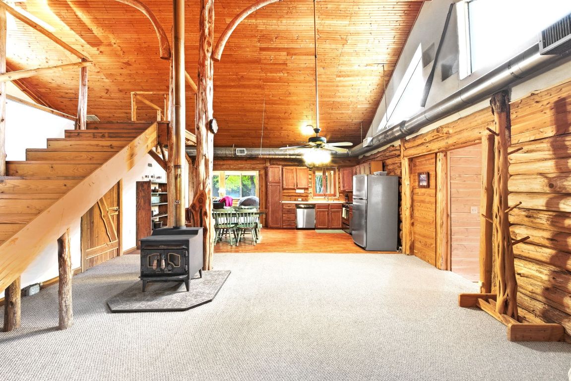 235 Antioch Road Paige, TX 78659 - Photo 5 of 40 a view of living room with a floor to ceiling windows
