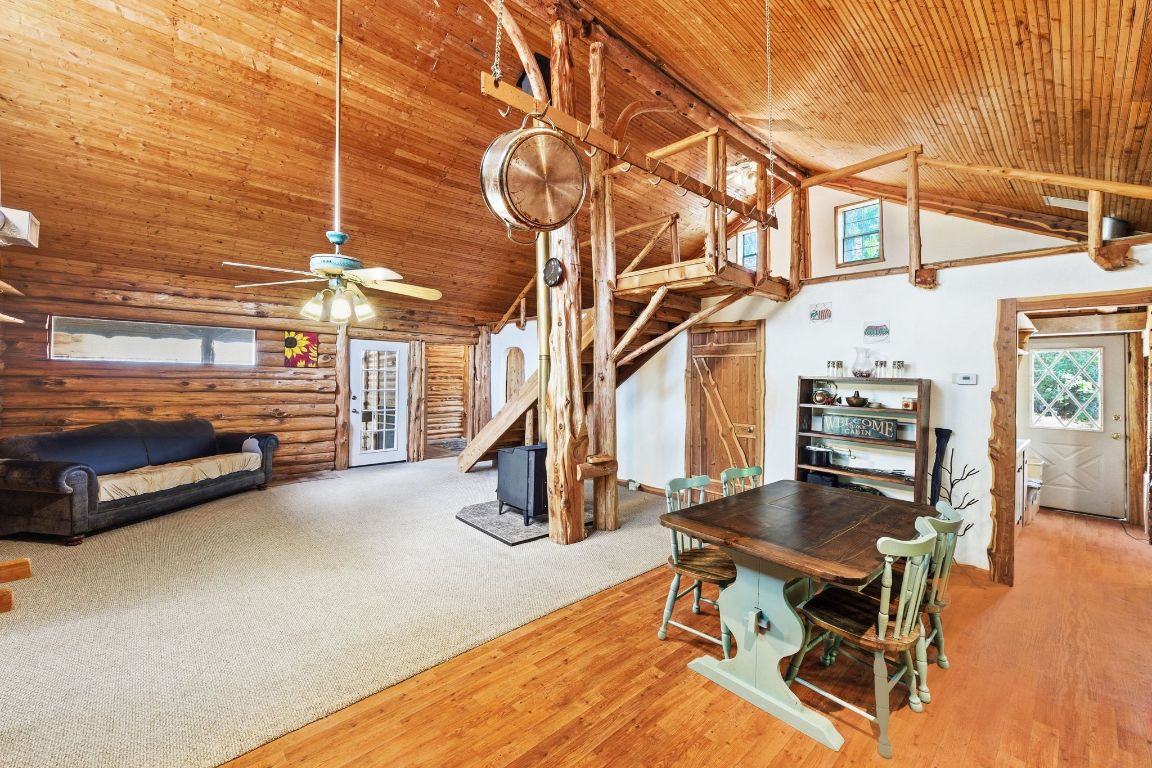 235 Antioch Road Paige, TX 78659 - Photo 9 of 40 a view of a chairs and table in a backyard