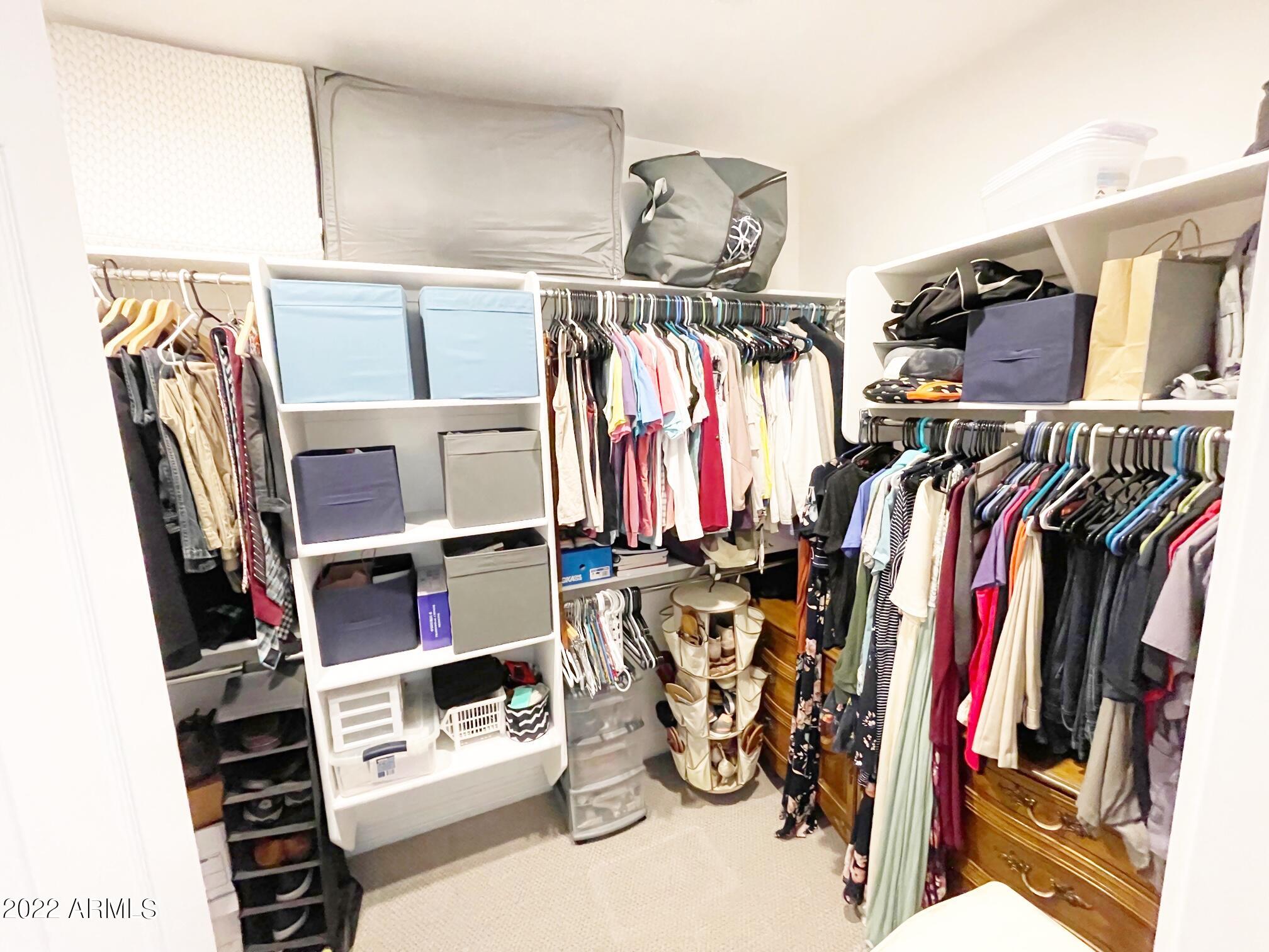 3330 West Fremont Rd. Phoenix, AZ 85041 - Photo 15 of 43 a view of walk in closet with clothes and shoes