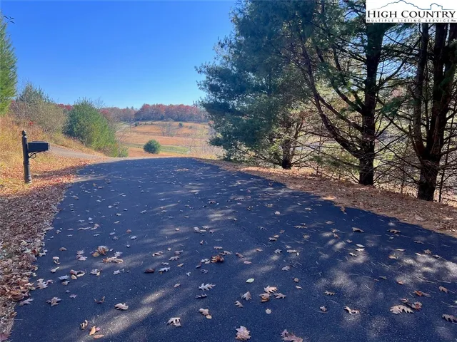a view of a lake with a yard