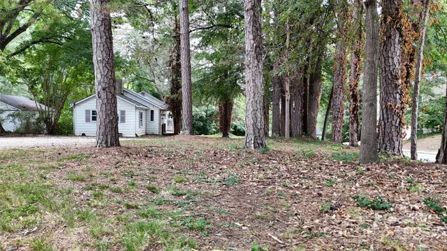a house with trees in front of it