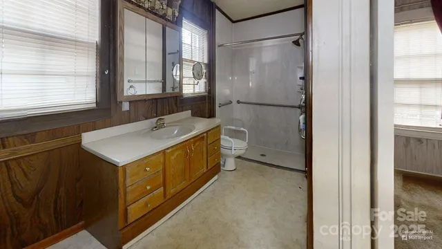 a bathroom with a sink a mirror and a bathtub