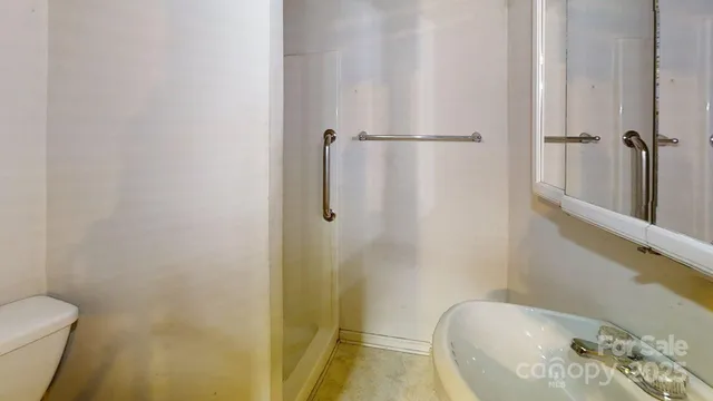 a bathroom with a bathtub and shower