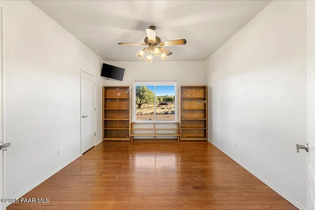 a spacious bathroom with a tub sink and mirror