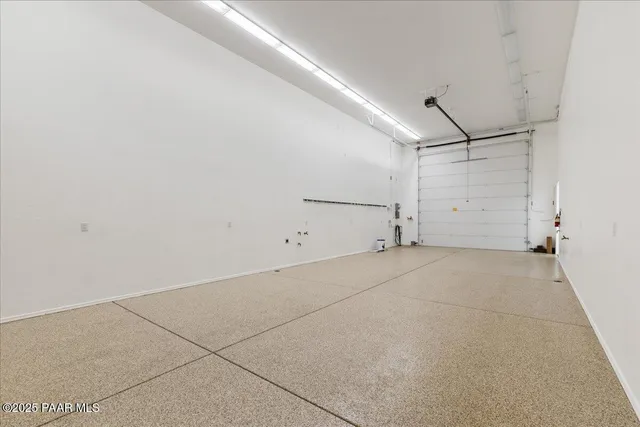 an aerial view of a house with a mountain view