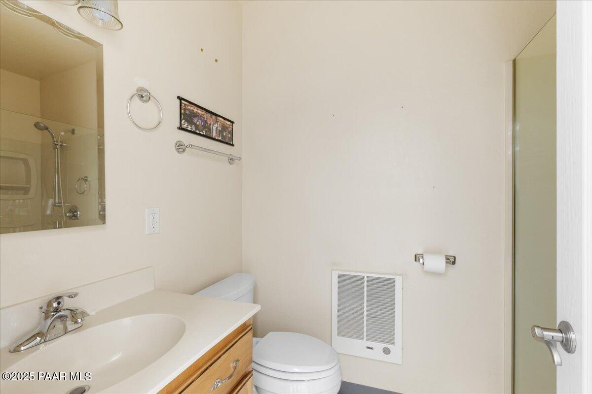 5540 Deer Spring Place Prescott, AZ 86305 - Photo 36 of 46 a bathroom with a sink toilet and shower