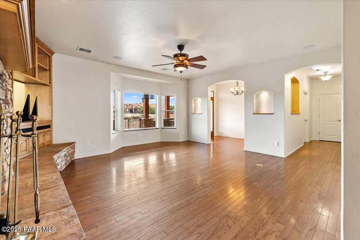 5540 Deer Spring Place Prescott, AZ 86305 - Photo 7 of 46 a view of an empty room with window and wooden floor