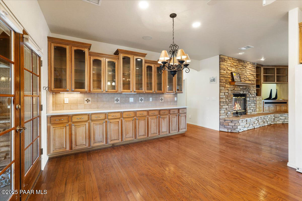 5540 Deer Spring Place Prescott, AZ 86305 - Photo 9 of 46 a view of a kitchen with granite countertop a large kitchen island in the center