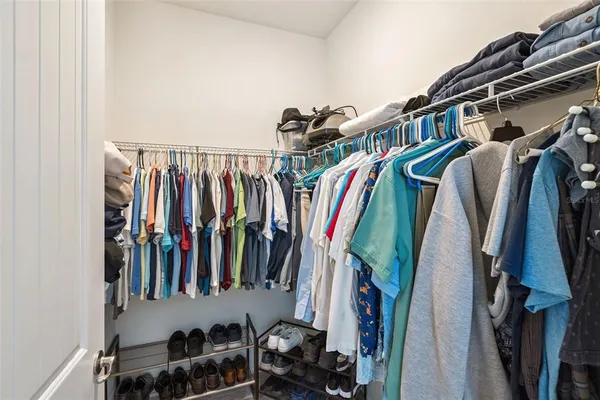 a spacious bathroom with a double vanity sink a mirror and shower