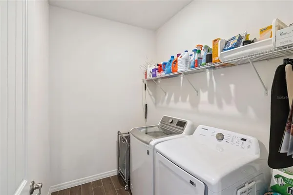 a living room with lots of furniture and a chandelier