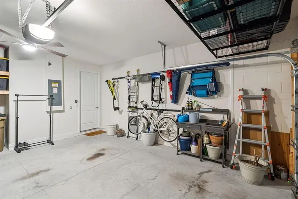 a view of a porch with chairs and potted plants
