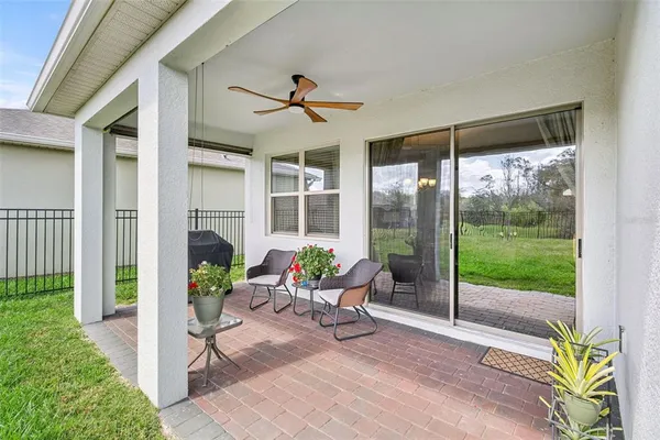 a front view of a house with a garden and plants