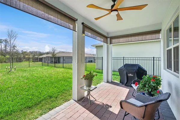 an aerial view of a house with a big yard