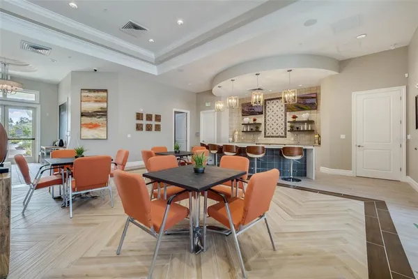 an aerial view of a house with a garden and lake view