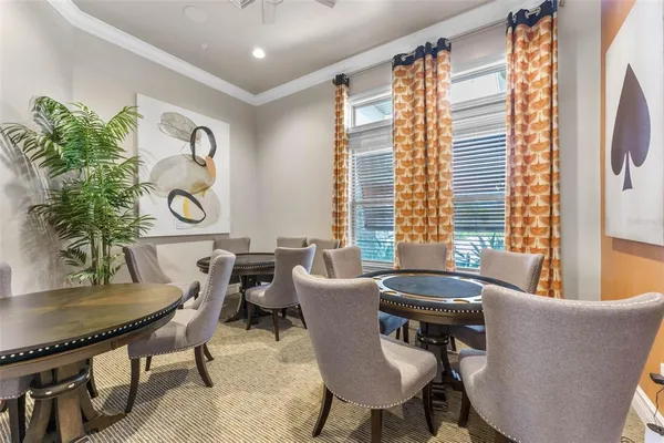 a view of backyard with swimming pool and sitting area