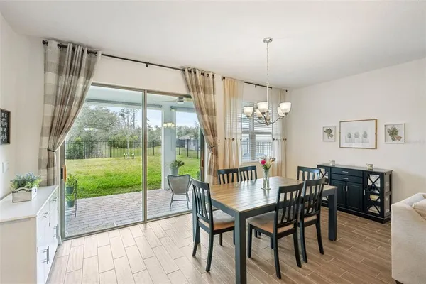 a kitchen with sink refrigerator and microwave