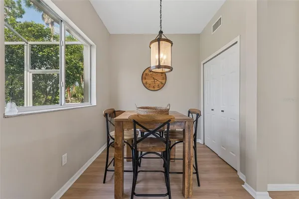a view of a dining room with furniture window and outside view