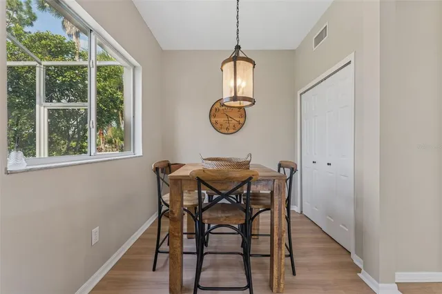 a view of a dining room with furniture window and outside view