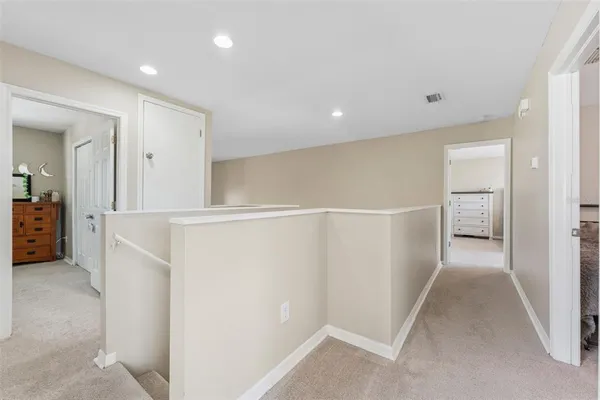 a view of a kitchen with a sink and cabinets