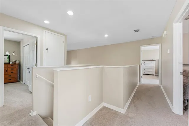 a view of a kitchen with a sink and cabinets