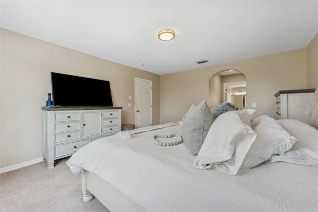 a large bathroom with a large tub and sink