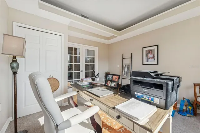 a view of a patio with a dining table and chairs