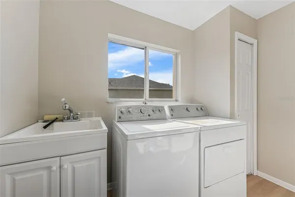 a view of a dining room with furniture wooden floor and a flat screen tv