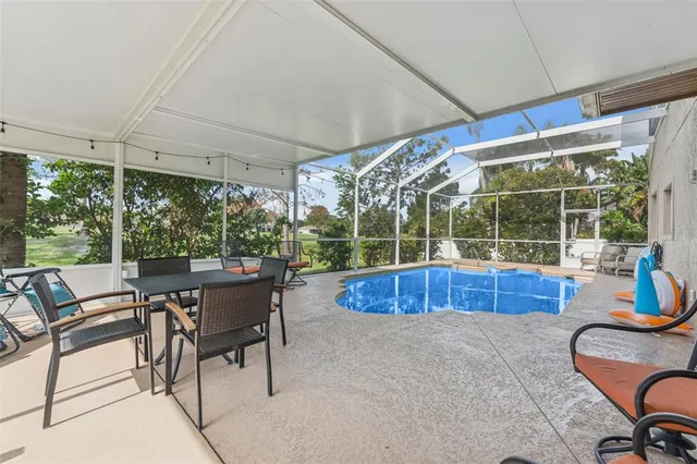 a view of a swimming pool with a patio