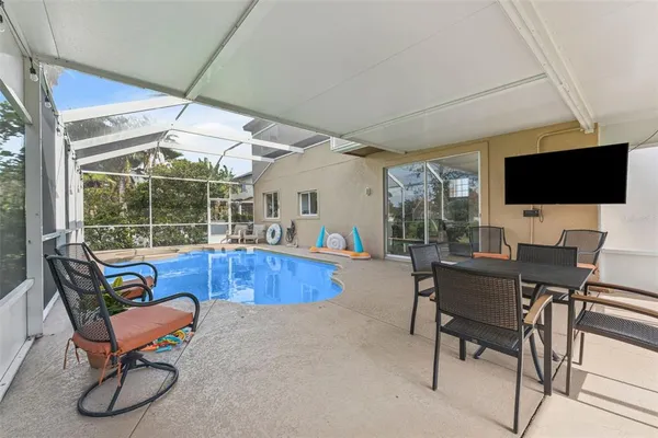 a view of swimming pool with furniture