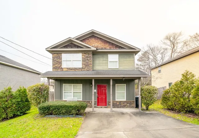 a front view of a house with garden
