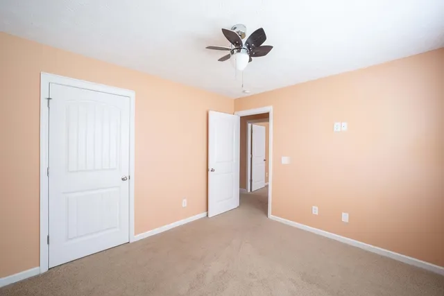 a view of a livingroom with a ceiling fan