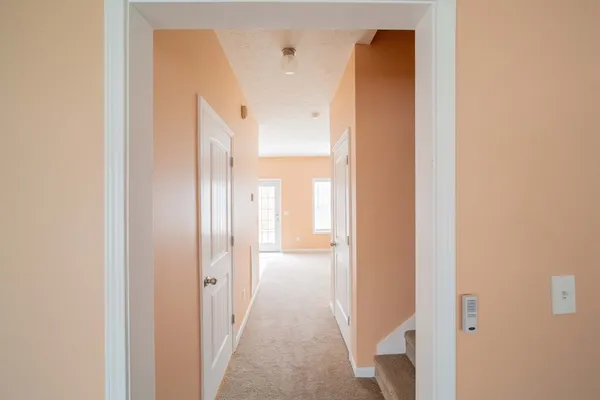 a view of a bathroom from a hallway