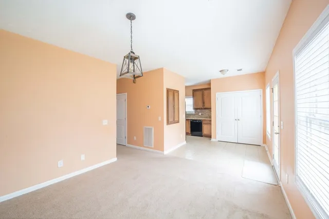 a view of a room with an entryway