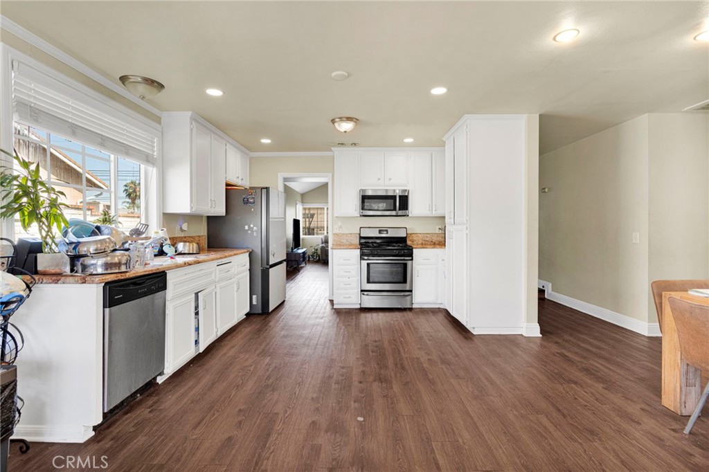 1087 Baseline Road La Verne, CA 91750 - Photo 14 of 39 a large kitchen with stainless steel appliances and a refrigerator