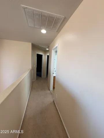 a view of hallway with an empty space