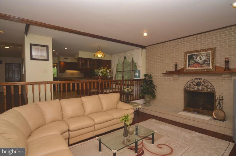 2111 Frederick Road Catonsville, MD 21228 - Photo 8 of 23 a living room with furniture and a fireplace