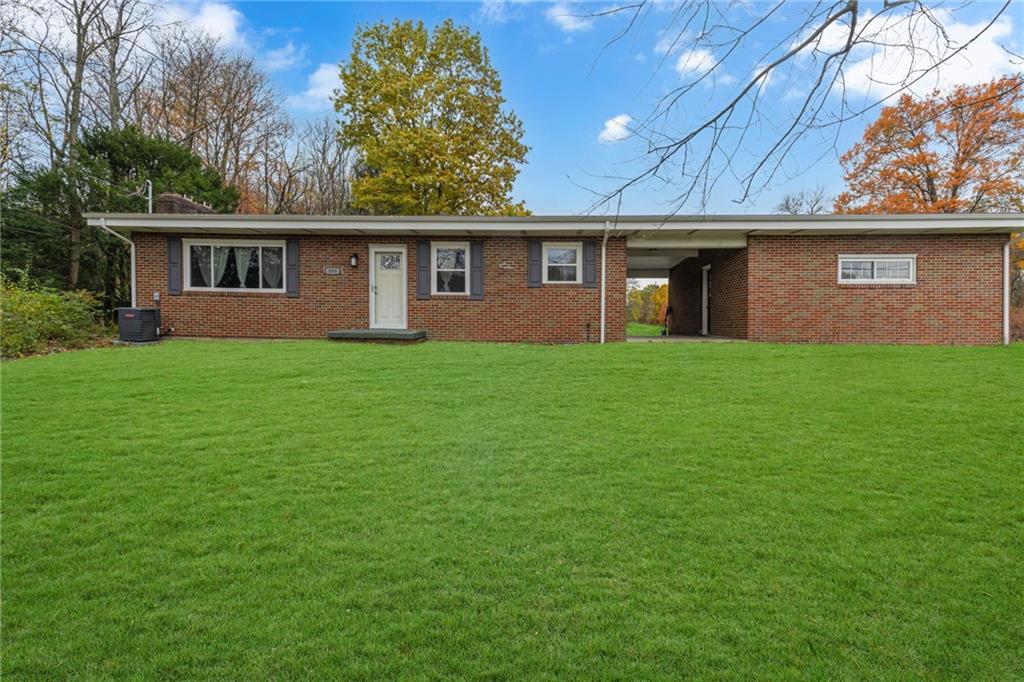 a front view of a house with yard