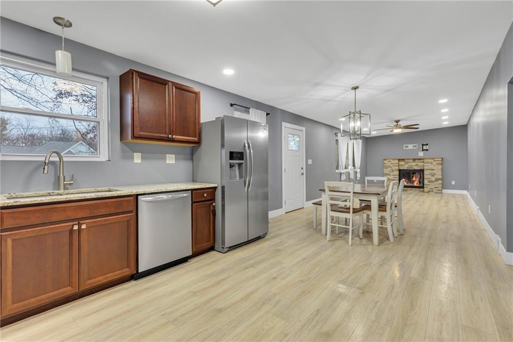 600 Neville Road Beaver, PA 15009 - Photo 3 of 23 a kitchen with stainless steel appliances kitchen island granite countertop a sink cabinets and wooden floor