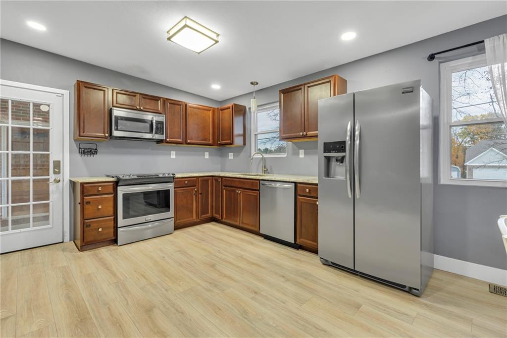 600 Neville Road Beaver, PA 15009 - Photo 6 of 23 a kitchen with stainless steel appliances granite countertop a refrigerator stove and sink