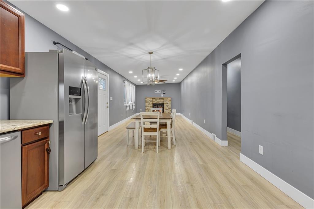 600 Neville Road Beaver, PA 15009 - Photo 7 of 23 a view of a kitchen with a sink and refrigerator