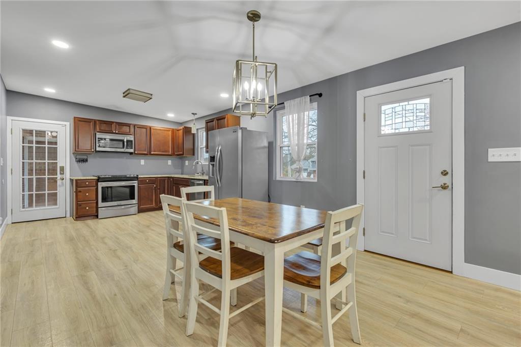 600 Neville Road Beaver, PA 15009 - Photo 9 of 23 a view of a dining room with furniture window and wooden floor