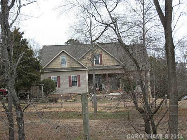 6028 Springhill Road, Unit 25 Stanfield, NC 28163 - Photo 1 of 15 front view of a house with a yard